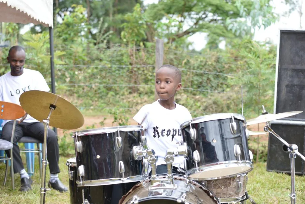 A learner playing drums