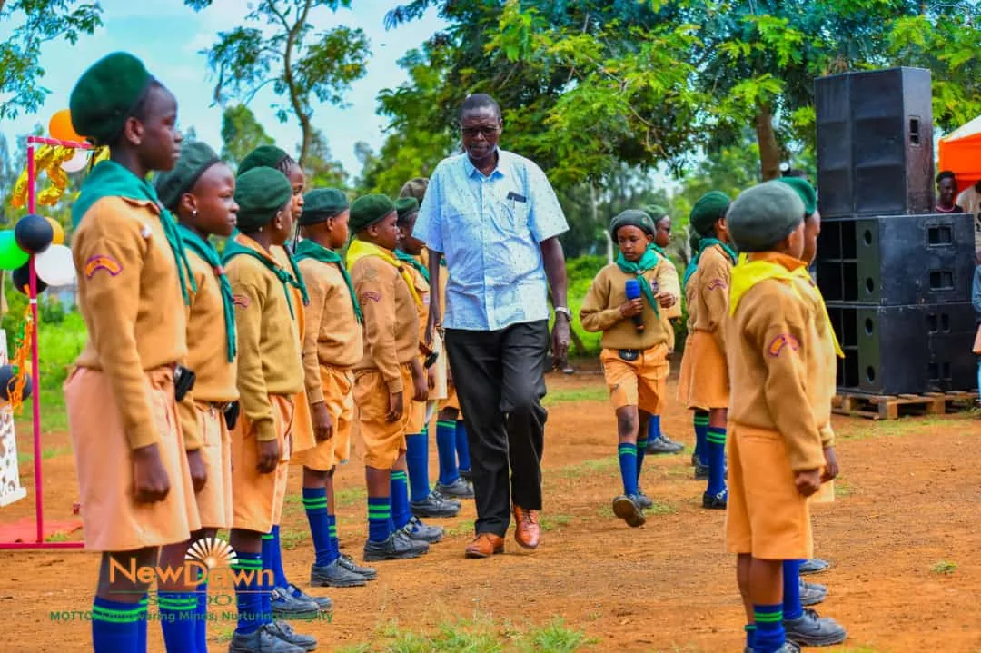 NewDawn learners with a teacher outdoors